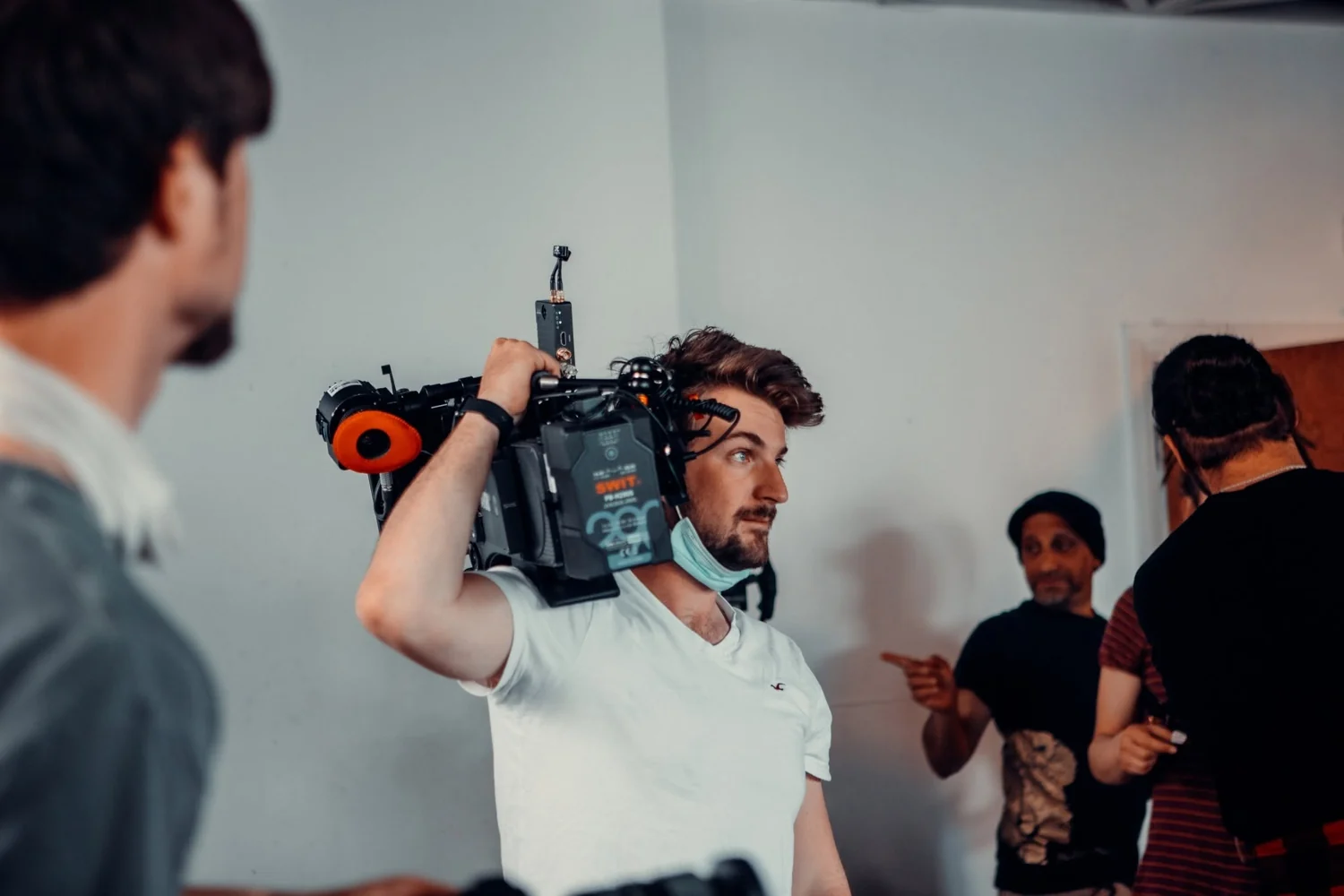 Working with a shoulder-mounted cinema camera on set